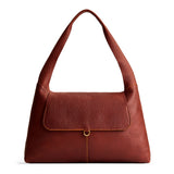 Nutmeg Large | Slouchy triangle shaped shoulder bag with a flap
