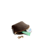 Coldbrew Small | Seashell shaped leather makeup bag with curved top zipper and flat bottom