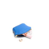 Skydive Small | Seashell shaped leather makeup bag with curved top zipper and flat bottom