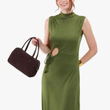 Velvet Brown Large | Model holding mini duffle shaped handbag with crossbody strap