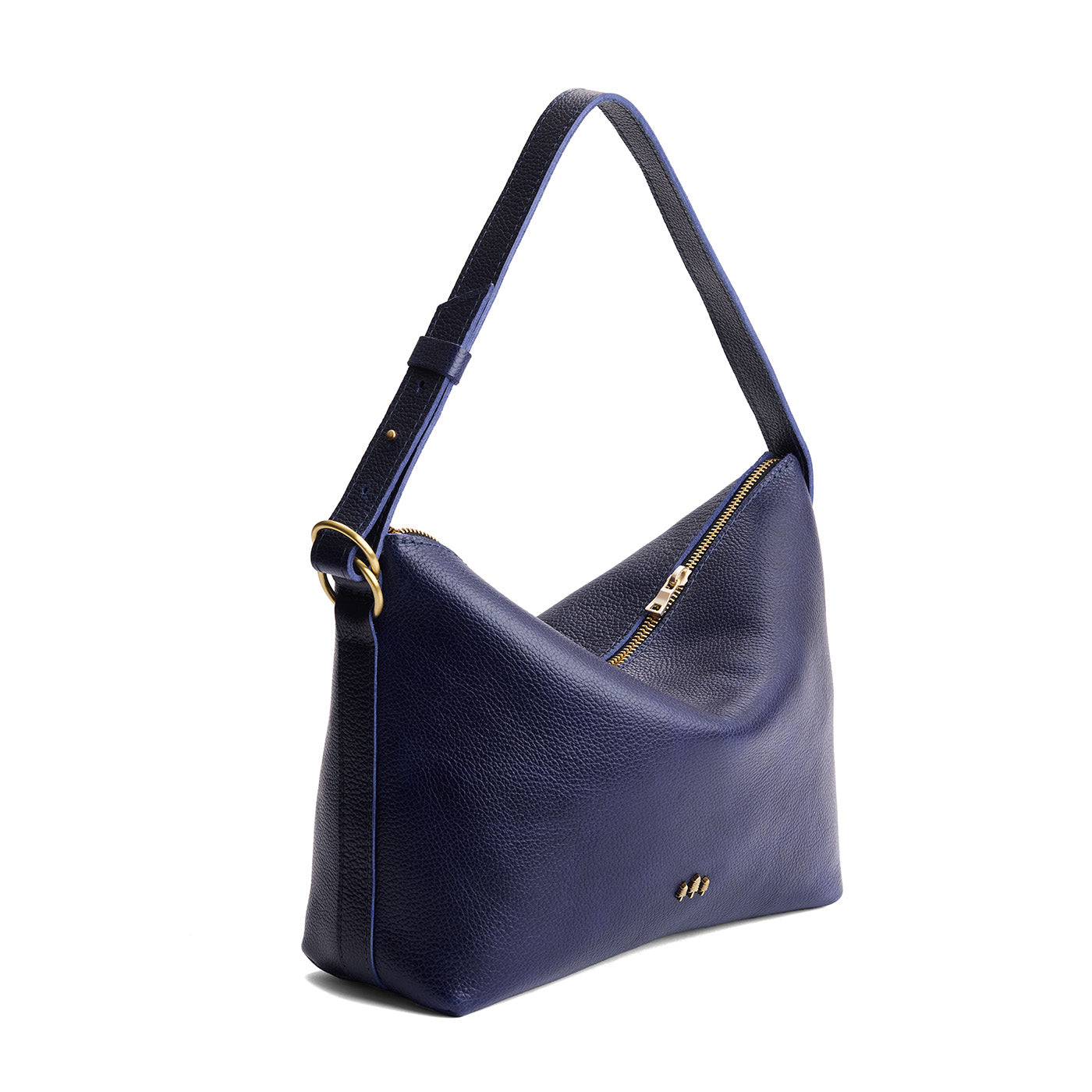 Cobalt*Large | Model Wearing medium sized slouchy leather shoulder bag with zipper opening and three metal tree emblems