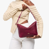 Orchid Small | Petite slouchy leather shoulder bag with zipper opening and three metal tree emblems