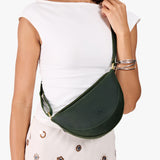 Evergreen Small | Model wearing petite half circle shaped sling bag