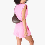 Grizzly Small | Model wearing petite half circle shaped sling bag