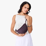 Larkspur Small | Model wearing petite half circle shaped sling bag