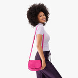 Royalty Small | Model wearing a leather Crossbody with a flap and magnetic closure