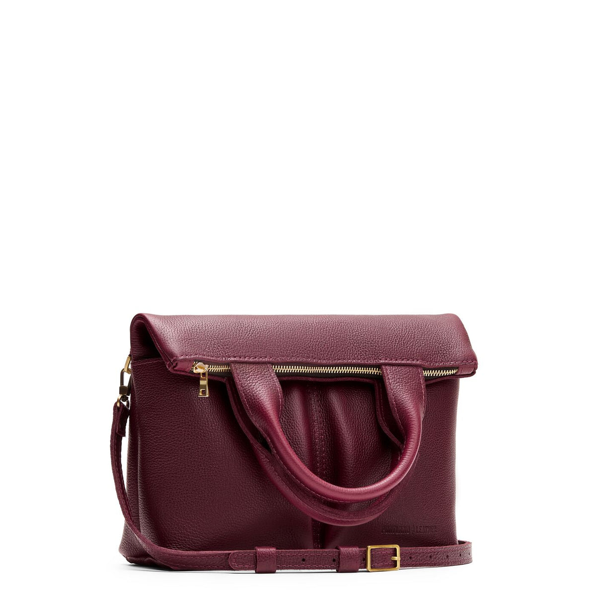 Cabernet*Small | Convertible tote clutch crossbody with two large front pocket and top carry handles folded into a clutch