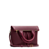 Cabernet Small | Convertible tote clutch crossbody with two large front pocket and top carry handles folded into a clutch