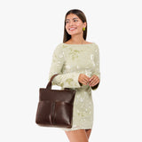 Coldbrew Small | Model wearing a convertible tote clutch crossbody