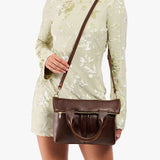 Coldbrew Small | Model wearing a convertible tote clutch crossbody