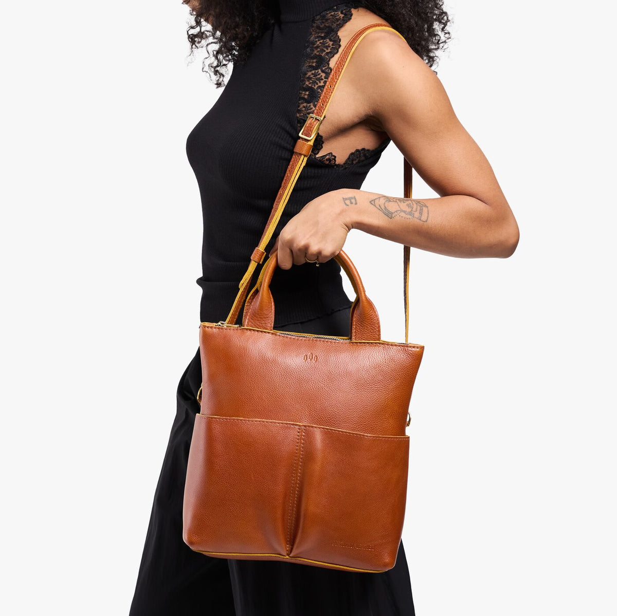 Sienna*Small | Model wearing a convertible tote clutch crossbody