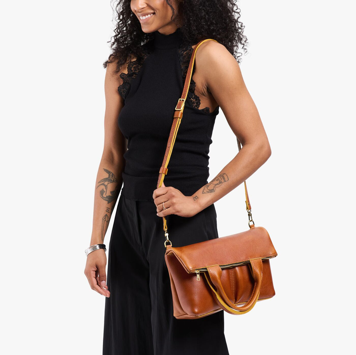 Sienna*Small | Model wearing a convertible tote clutch crossbody
