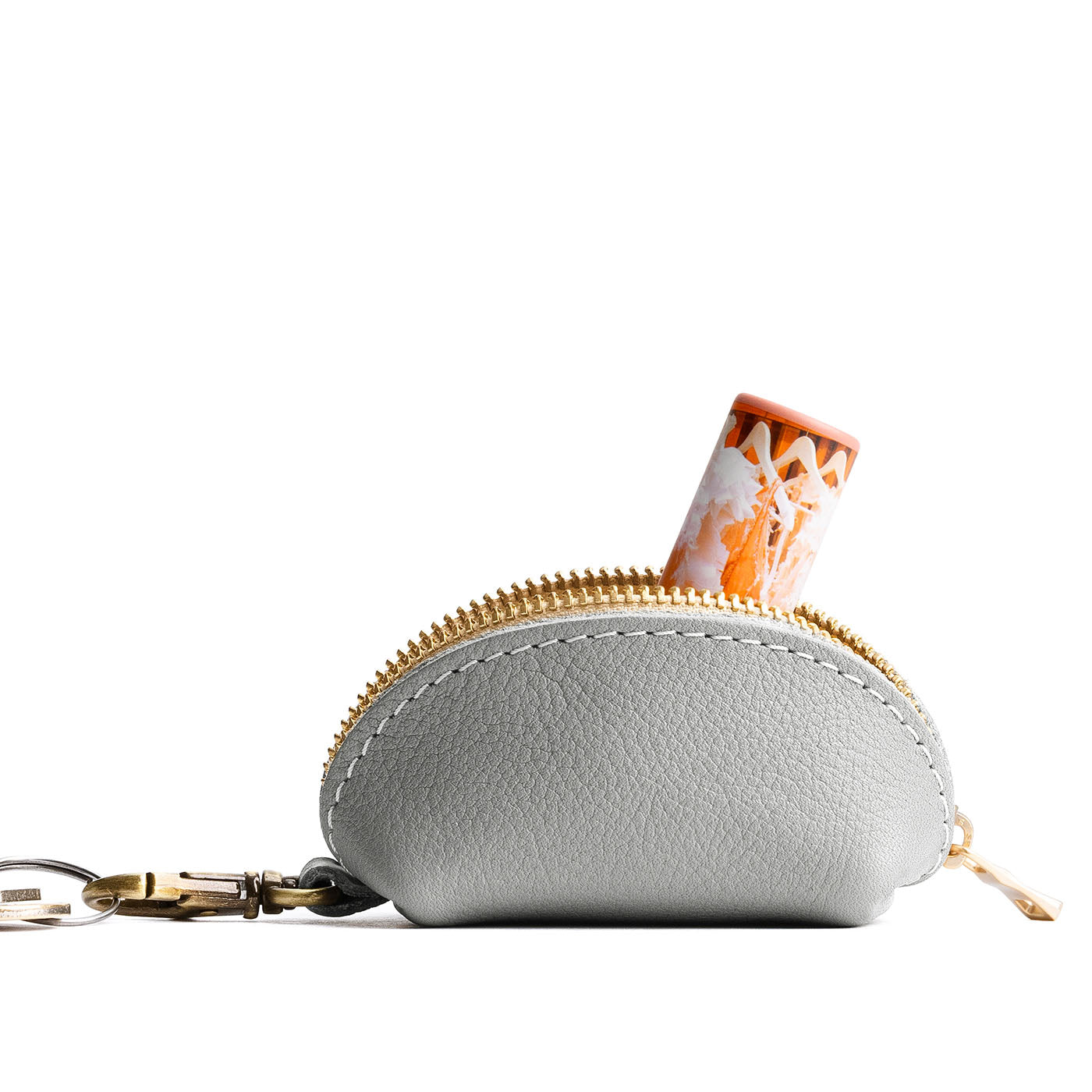 Nimbus | Taco shaped leather pouch with zipper and swivel lobster clasp on white background