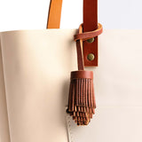 Nutmeg | Pom-pom style with tiered leather fringe
