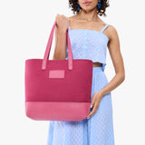 Rose Pop | Model holding canvas tote with leather base and handles