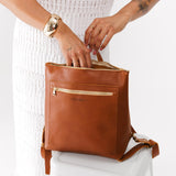 All Color: Honey Classic | Model holding square slim leather tote backpack