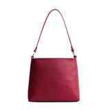 Berry Good Classic | Triangular shoulder bag with antiqued brass finished hardware