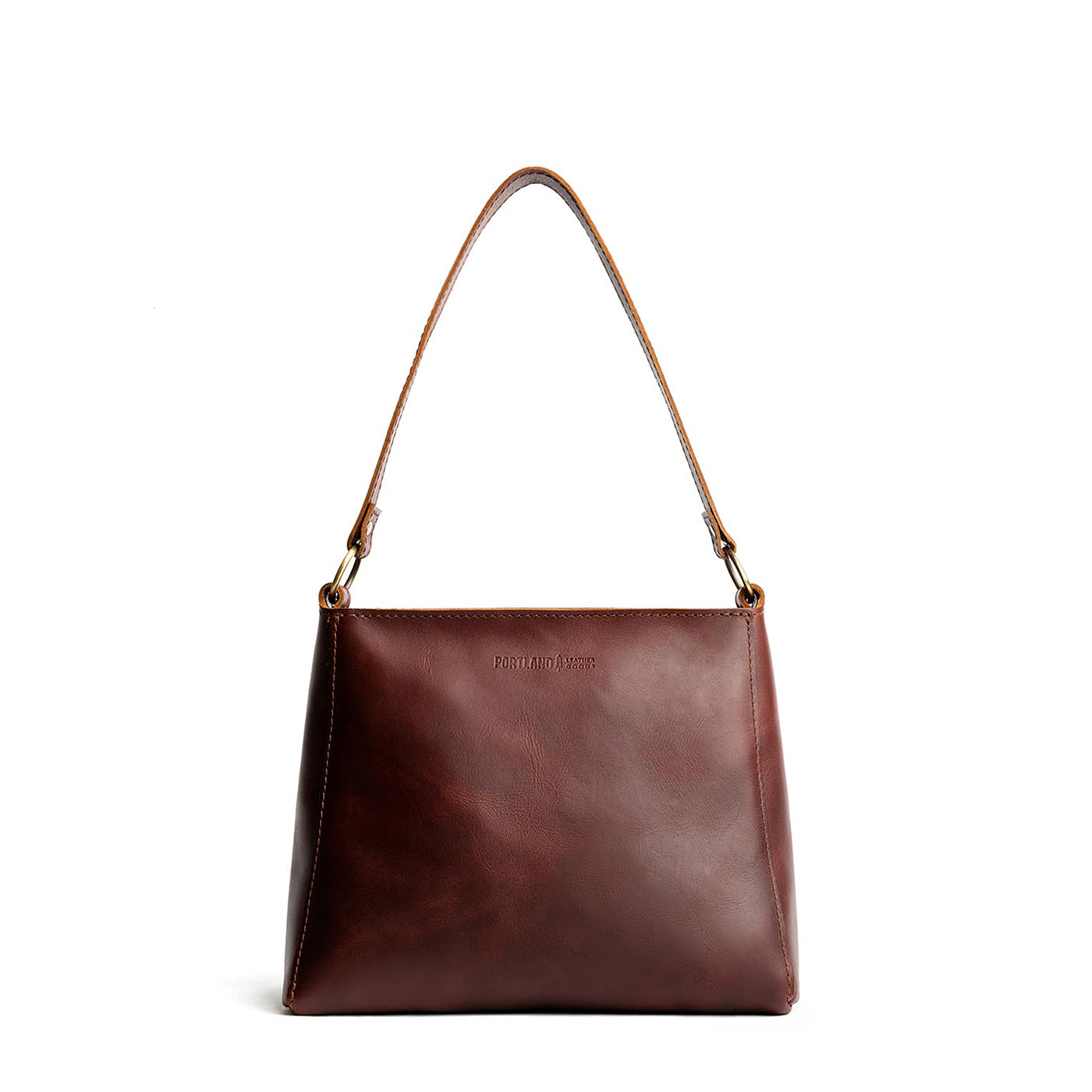 Cognac*Classic | Triangular shoulder bag with antiqued brass finished hardware