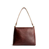 Cognac*Classic | Triangular shoulder bag with antiqued brass finished hardware