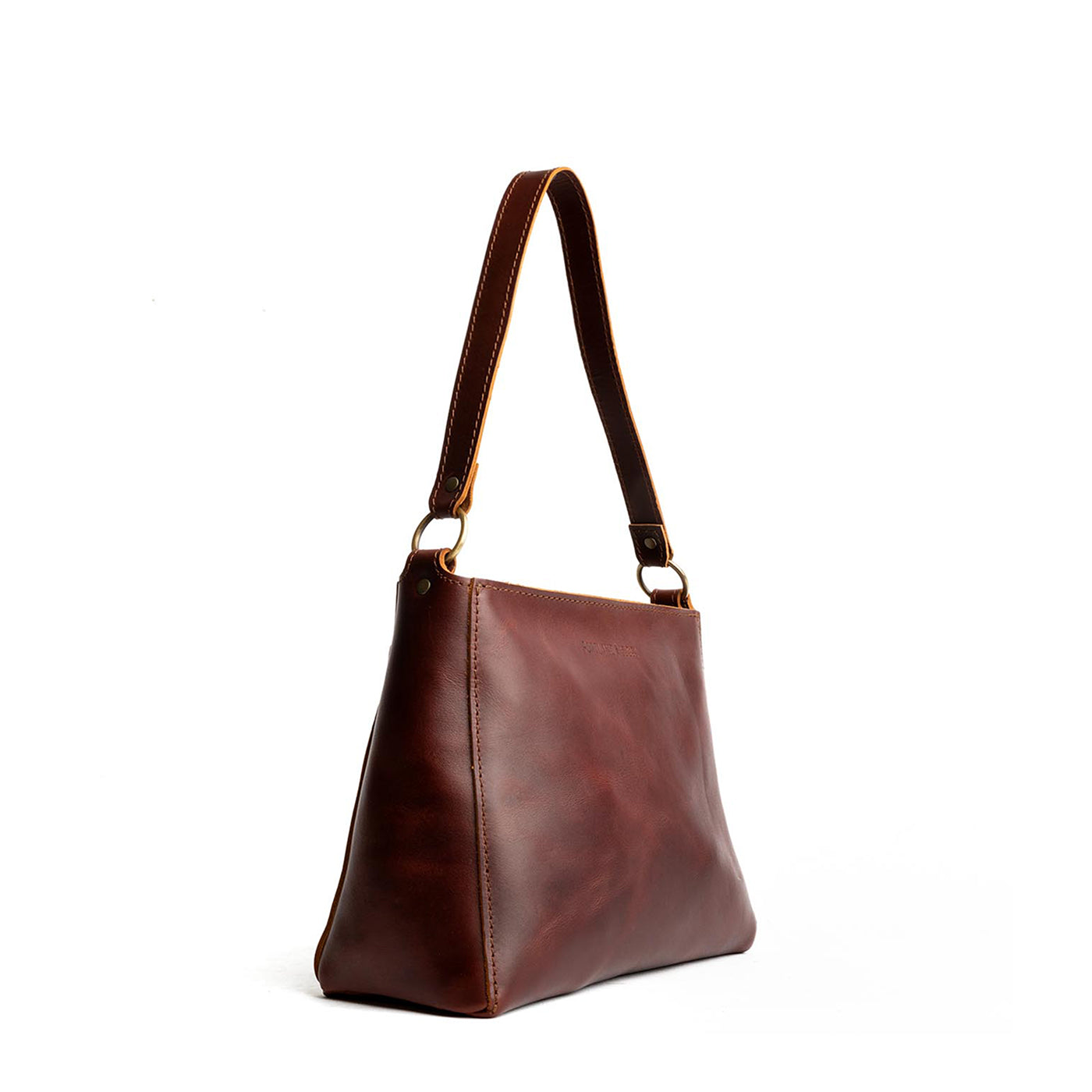 Cognac*Classic | Triangular shoulder bag with antiqued brass finished hardware