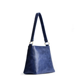 Cowboy Blue | Triangular shoulder bag with antiqued brass finished hardware
