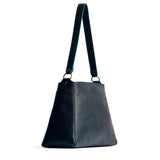 Boreal Large | Large triangular shoulder bag with antiqued brass finished hardware