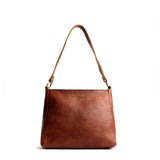 Nutmeg Classic | Triangular shoulder bag with antiqued brass finished hardware