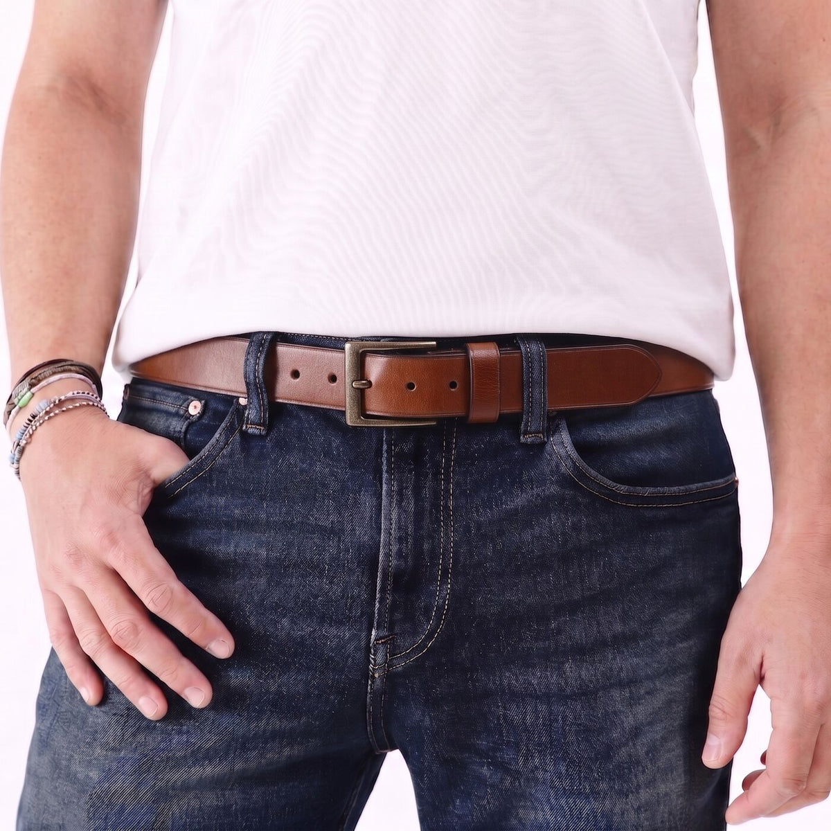 Amber | Mens smooth leather belt with antique brass buckle on model