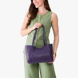 Empire Medium | Model holding midsize rectangular tote bag