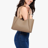 Stone Medium | Model holding midsize rectangular tote bag
