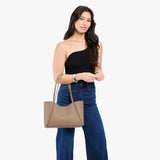 Stone Medium | Model holding midsize rectangular tote bag