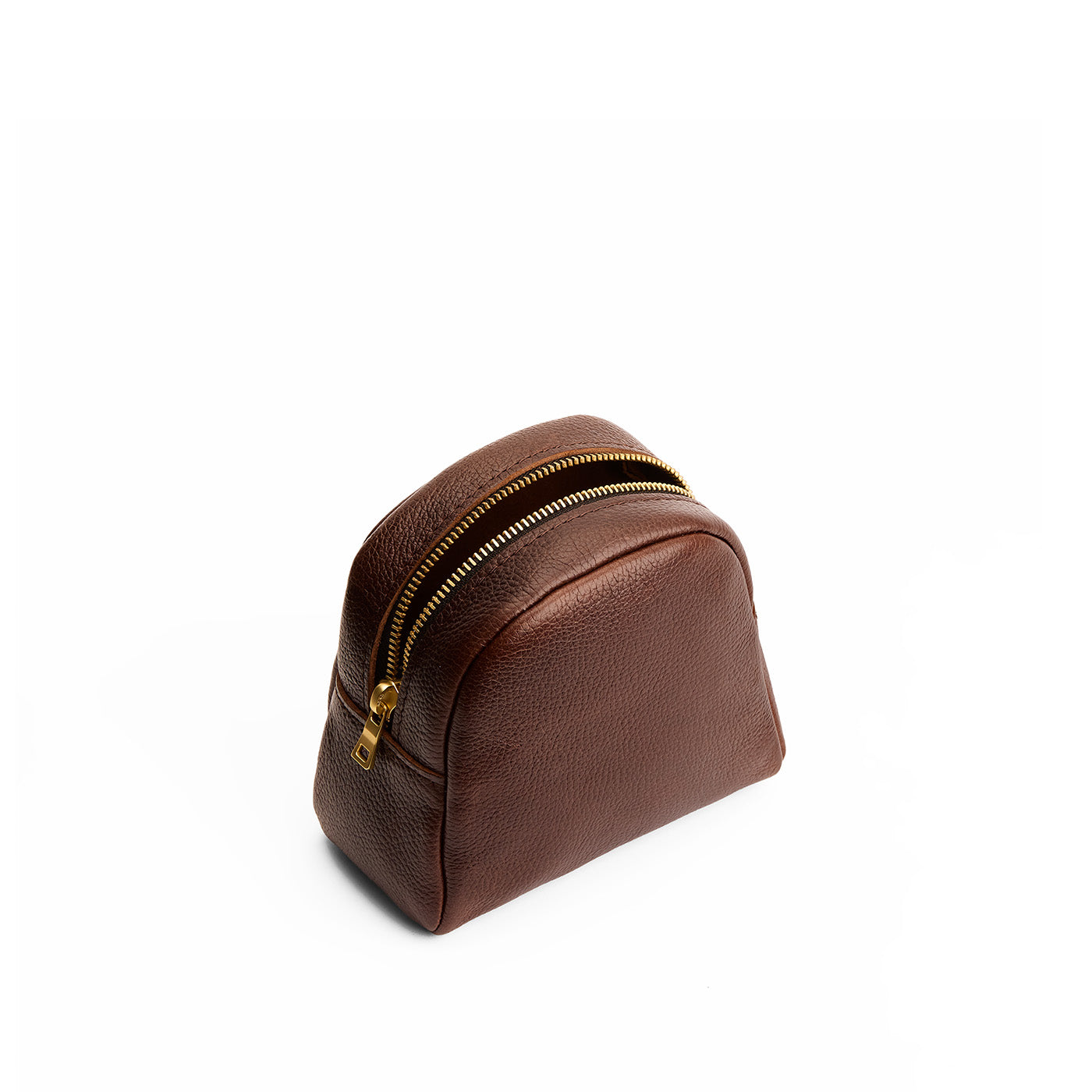 Coldbrew | Curved top leather pouch with zipper opening, flat base, and three metal tree emblems in front