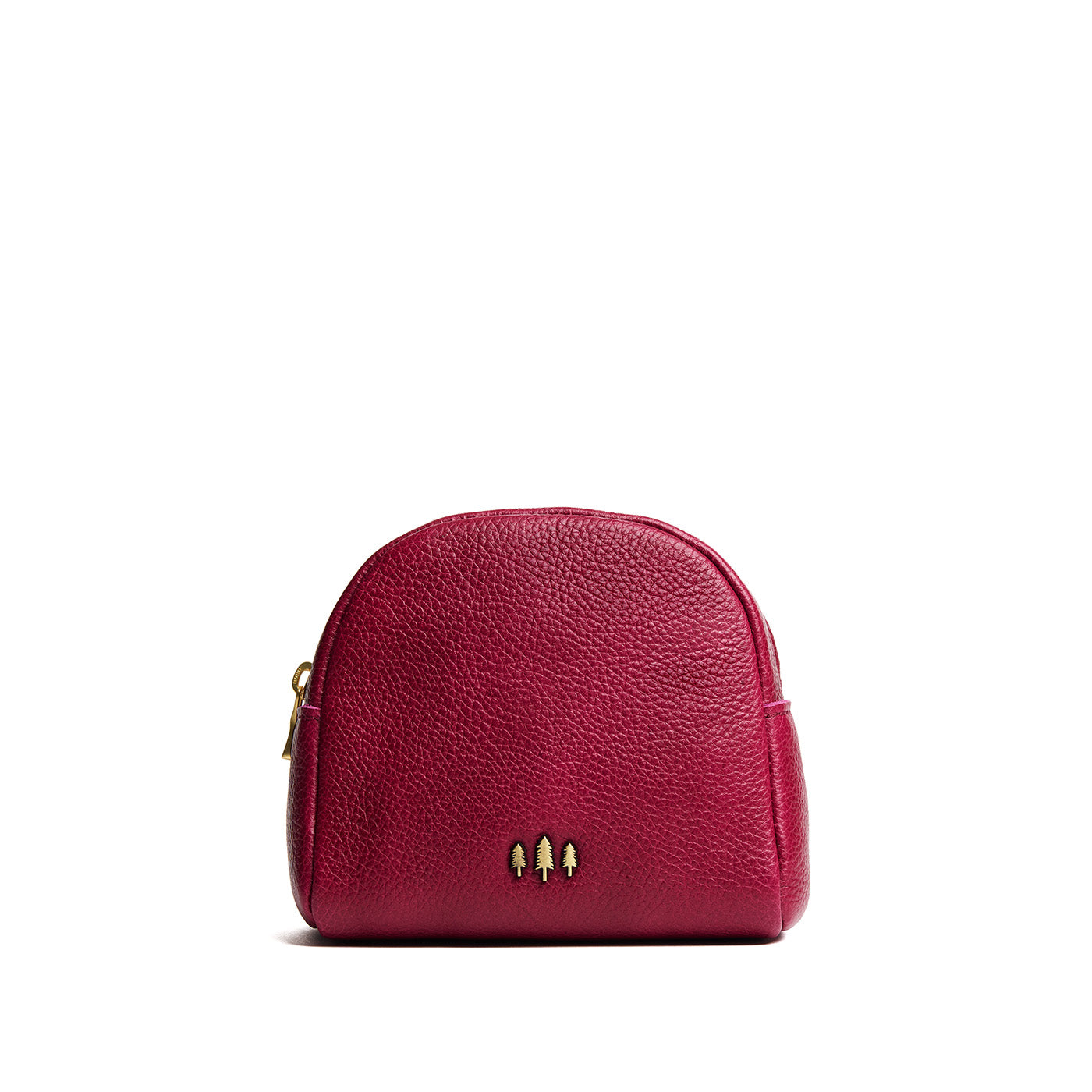 Orchid | Curved top leather pouch with zipper opening, flat base, and three metal tree emblems in front