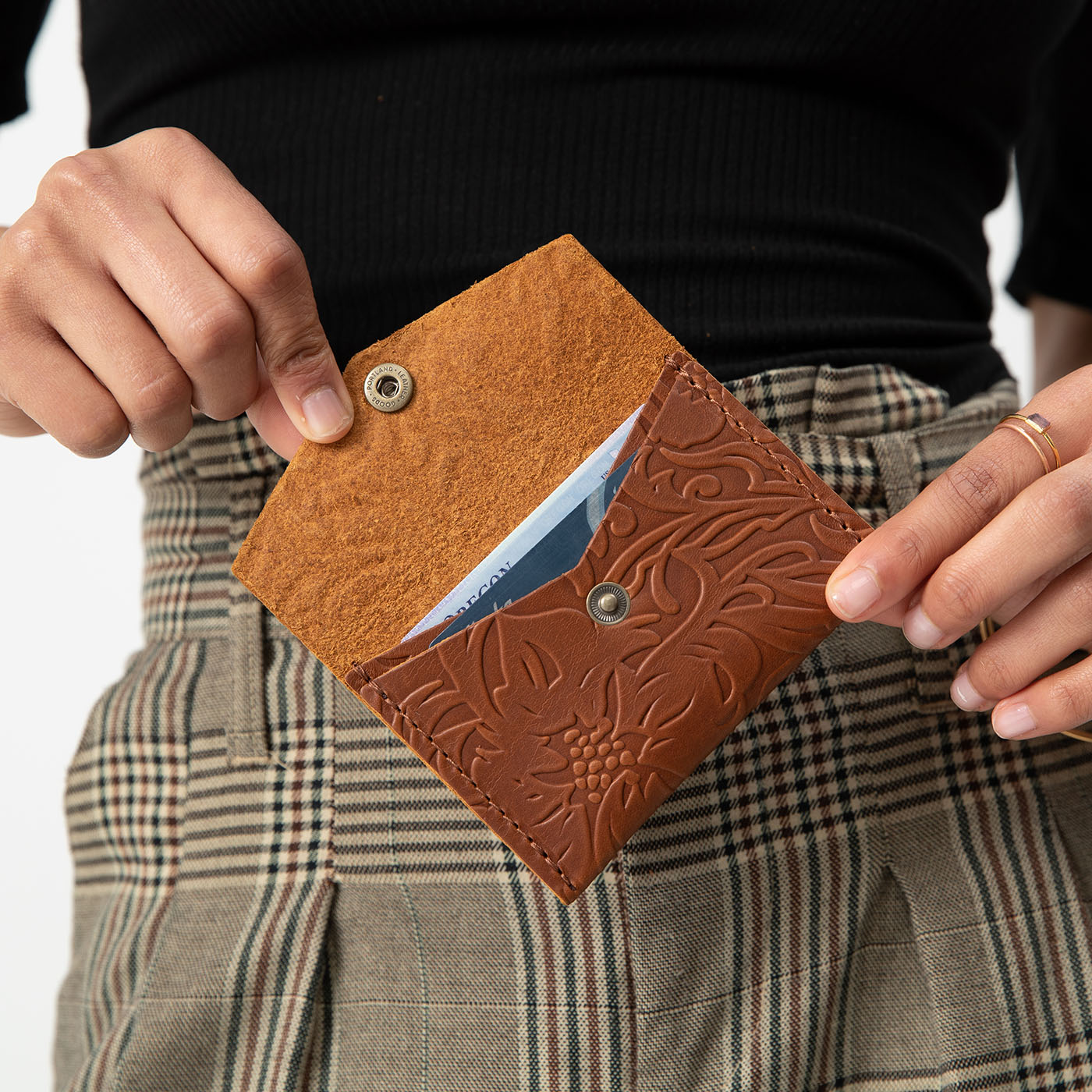 Meadow | Model holding small leather envelope card wallet open