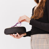 All Color: Black | Leather pouch with curved seams and top zipper